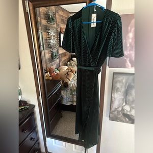 New with tags. Green velvety wrap dress high low